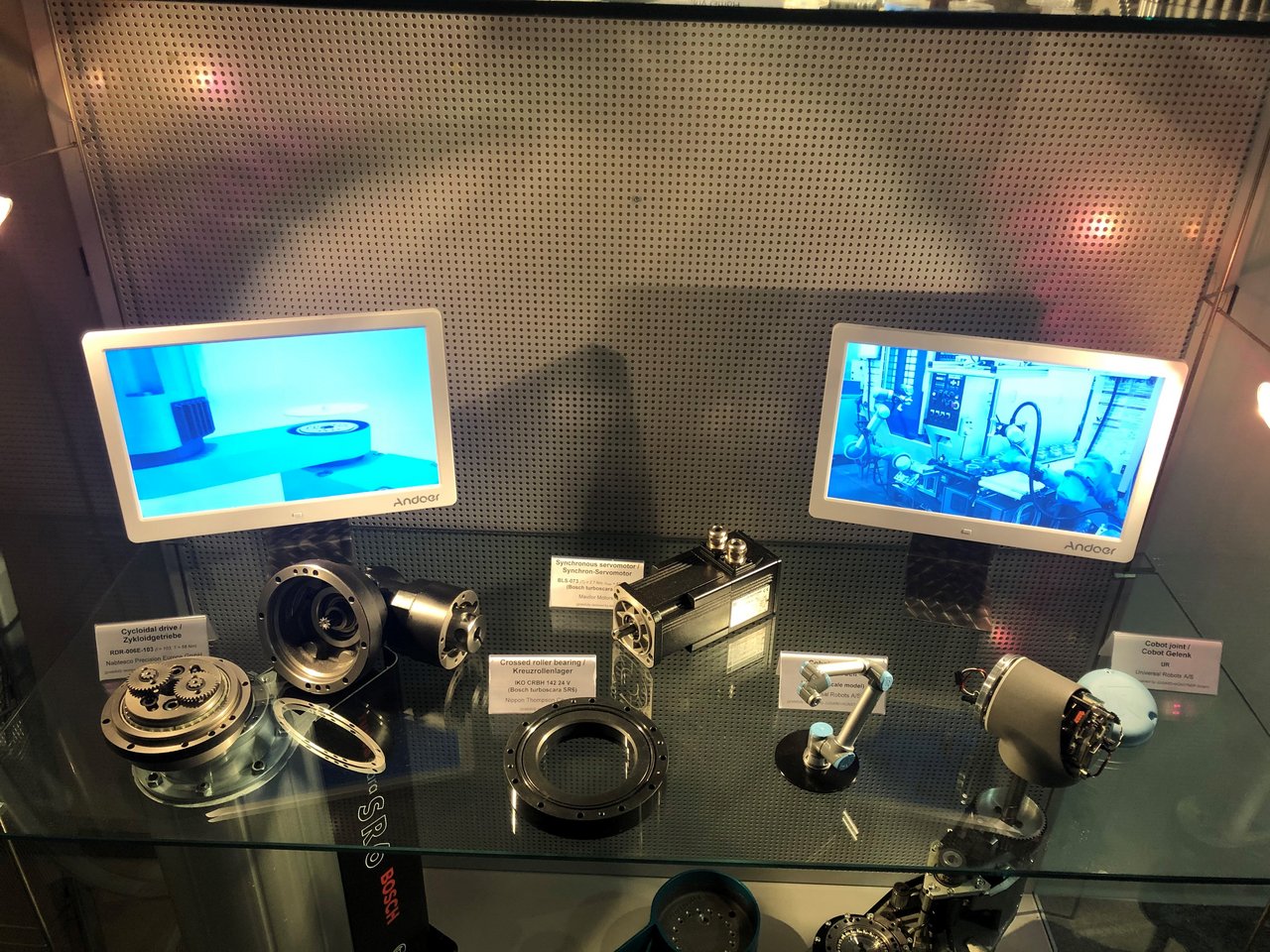 Middle drawer of the glass box with the exhibition of drive systems of robots