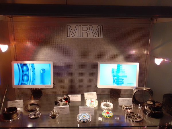 Upper drawer of the glass case with the exhibition of drive systems of robots